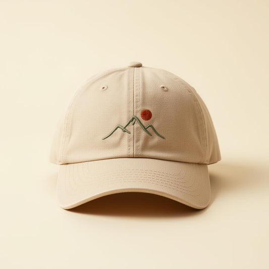Beige cap with embroidered design on a beige background